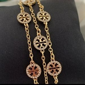 Tory Burch Gold Triple Strand Pavé Bracelet.